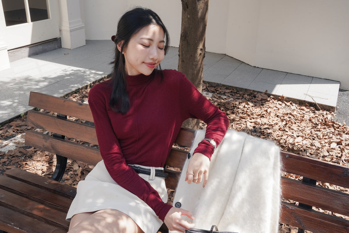 Burgundy Muse High-Neck Top, new version without waist ties, seated view